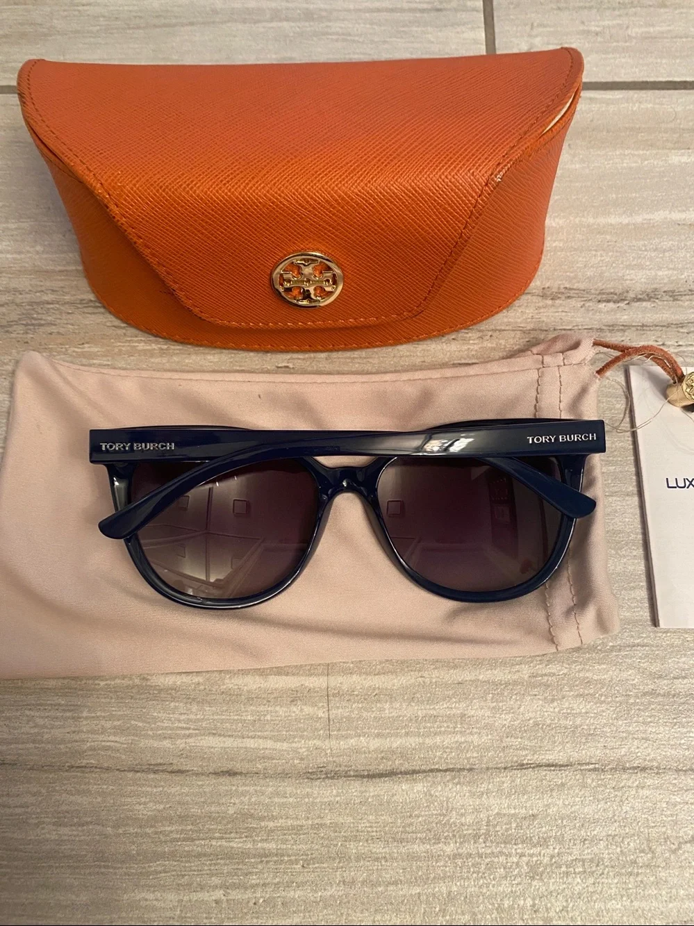 Tory Burch Navy sunglasses with cases.